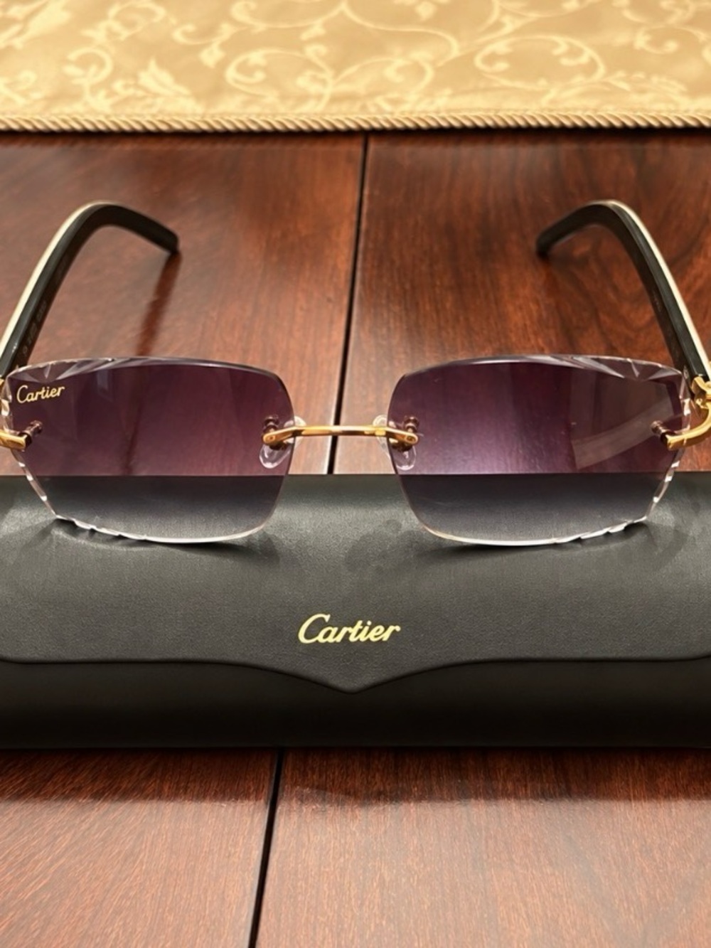 Authentic Cartier Women's Rimless Sunglasses - Black/Purple edged Lenses.